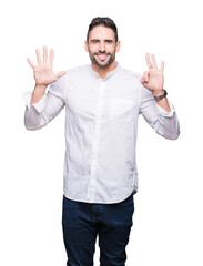 Fototapeta premium Young business man over isolated background showing and pointing up with fingers number eight while smiling confident and happy.