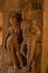 Stone carved divine couple. temples and shrines at Pattadakal temple complex, 7th century, Karnataka, India. UNESCO World Heritage Site.