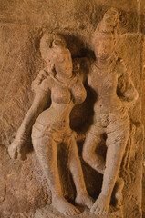 Stone carved divine couple. temples and shrines at Pattadakal temple complex, 7th century, Karnataka, India. UNESCO World Heritage Site.