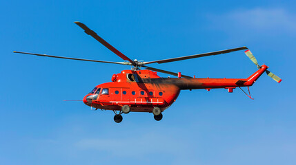 Red rescue helicopter flying in air