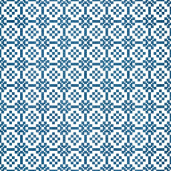 Seamless pattern with decorative thai flowers on indigo dyed fabric background.