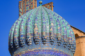 Mosaic-covered cupola of the Sher-Dor madrasah on the Registan Square in Samarkand, Uzbekistan