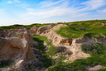 Afrasiyab (Afrosiyob) ancient settlement in ruins in Samarkand, Uzbekistan - Archaeological excavations on a grassy hill of Maracanda in Central Asia