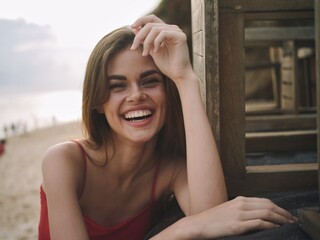 Portrait of a woman with a beautiful smile with teeth looking into the camera, happiness in the...