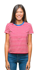 Obraz premium Young asian woman over isolated background with a happy and cool smile on face. Lucky person.