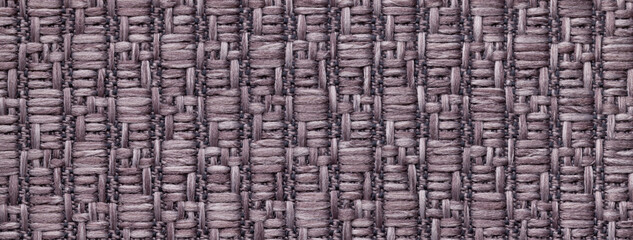 Texture of brown color background from woven textile material with wicker pattern, macro. Vintage...