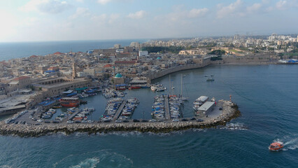 Obraz premium Acre city Harbor port with small boats, droneBeautiful shot from Israel acre city, aerial,2022