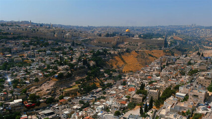 Fototapeta premium East jerusalem old city and arab neighborhood, aerial Beautiful drone shot from Old city of Jerusalem al Aqsa Mosque, June, 2022, israel 