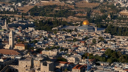 Fototapeta na wymiar The old city of Jerusalem at golden Hour,Aerial view, 2022 Beautiful shot from the old city of Jerusalem