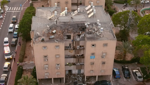 Building rooftop destroyed by Hamas Rocket, Israel,Aerial view

Drone view over ruined home Targeted by Hamas terror organization from Gaza, Ashkelon,Israel,May,10,2021

