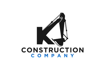 Logo design of an excavator at a construction site with the initials letters K, Heavy equipment work earth mover. © 21graphic