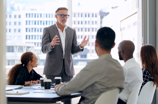 Group, meeting and explaining of boss in boardroom, planning and information for training of staff in startup. City, professional and events company with teamwork for project in New York and people