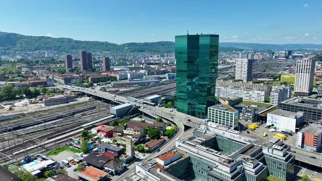 Aerial view of Swiss City of Z&uuml;rich with skyline, skyscraper and Hard Bride at industrial district on a sunny noon. Movie shot May 10th, 2024, Zurich, Switzerland.