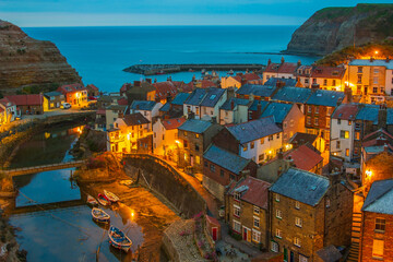 Pretty Staithes village from above in Yorkshire in the UK after the sun has gone down