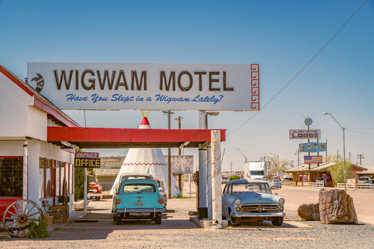 Holbrook, AZ, US-April 13, 2024: Wigwam Motel, part of a motel chain built during the 1930s and 1940s on historic Route 66. The rooms are in teepees with classic cars in front.