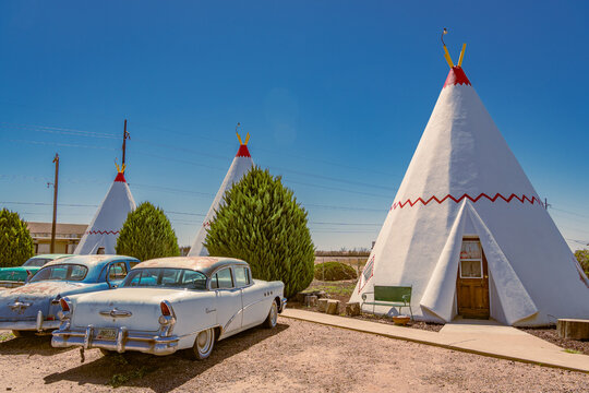 Holbrook, AZ, US-April 13, 2024: Wigwam Motel, part of a motel chain built during the 1930s and 1940s on historic Route 66. The rooms are in teepees with classic cars in front.