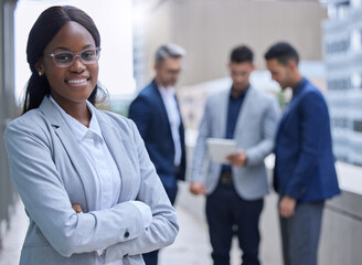 Portrait, business people and black woman with arms crossed, balcony and confidence with career ambition. Outdoor, employees and lawyer with pride, internship and buildings with candidate attorney