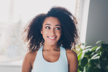 Portrait of pretty sportive young girl beaming smile fantasize sportswear morning workout apartment...