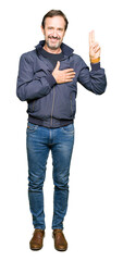 Middle age handsome man wearing a jacket Swearing with hand on chest and fingers, making a loyalty...