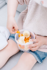 Little Child Eating a Healthy Fruit Snack