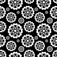 Black white seamless background with flowers ..Abstract, repeating regular pattern for print ..Graphic design with regular shapes.