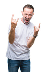 Middle age hoary senior man wearing white t-shirt over isolated background shouting with crazy expression doing rock symbol with hands up. Music star. Heavy concept.