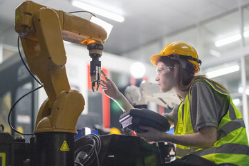 Trainees master robotics with hands-on workshops and quality control in manufacturing academy.