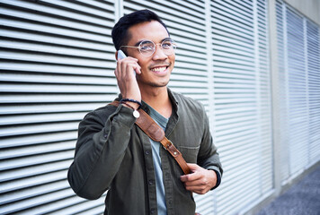 Asian man, talk and phone call outdoor with glasses for virtual conversation, leather bag and...
