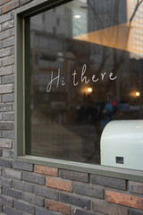 Street cafe sign on a large window