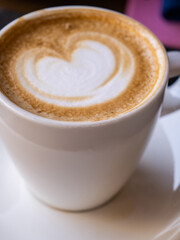 Coffe latte with a heart top view