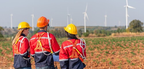 engineer team inspection check control wind power machine construction installation in wind energy factory. technician professional worker discussion check for maintenance electronic wind turbine