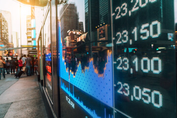 Dynamic Evening Scene of Stock Market Display in City