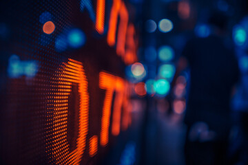 Illuminated Stock Market Ticker Display at Night