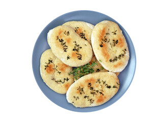 Thyme naan bread on a grey-blue plate.