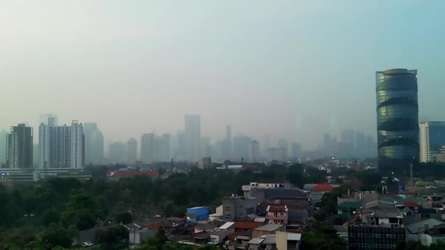 Jakarta&rsquo;s skyline time lapse footage while sunrise faded citilights. Climate change concept