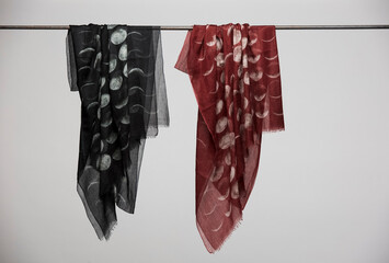 Hanging silk scarves display still life
