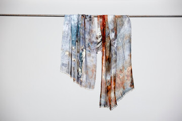 Hanging silk scarves display still life