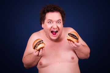 Sports nutrition and healthy lifestyle. Funny fat man and his bad dieting habits. Blue background.