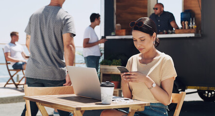 Phone, laptop and woman at outdoor cafe for remote work, networking or checking email, post or social media. Smartphone, computer and creative freelancer at coffee shop for online project research.