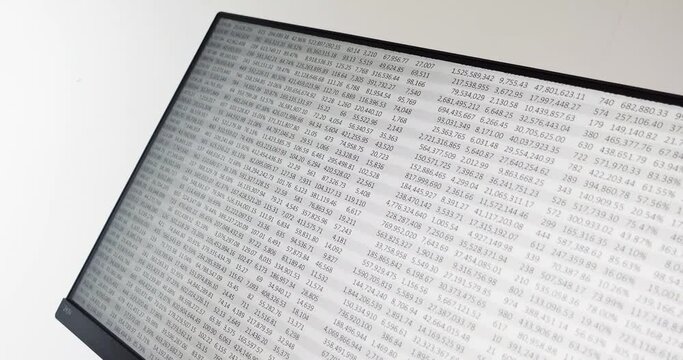 Spreadsheet scrolling downwards displayed on computer monitor at an angle
