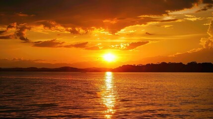 Obraz premium The vibrantly hued sunset painted the sky in mesmerizing shades of orange and yellow embodying the essence of World Environment Day