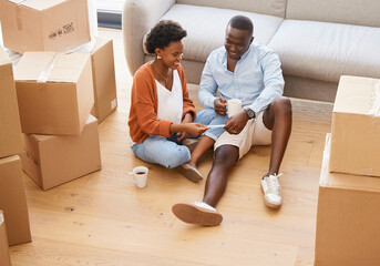 Woman, man and boxes in pregnancy as happy for moving, house and relocating on floor in living...
