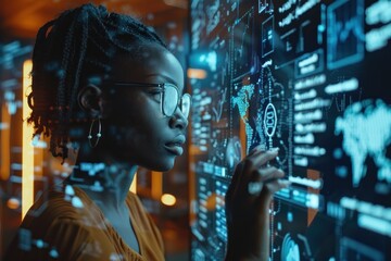 A woman is looking at a computer screen with a lot of numbers and graphs