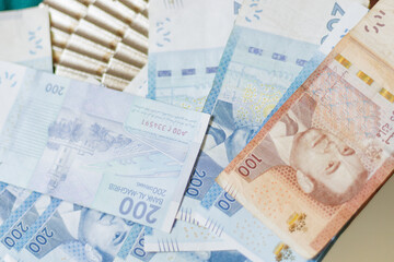 Wallet on a wad of Moroccan dirham bills.