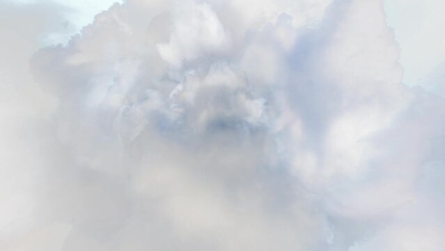 Clouds Tunnel Animation Background Loop. A realistic looking animation where the camera moves through a tunnel of clouds.