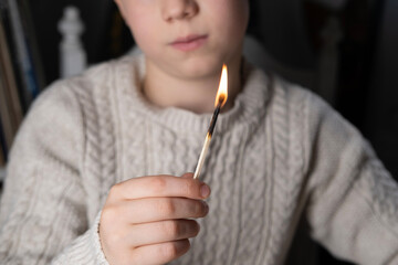 Child holding lit burning match, Fire Safety Education, Supervised Playtime, Parental Guidance,...