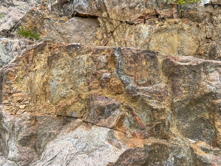 Old rock with crevices closeup