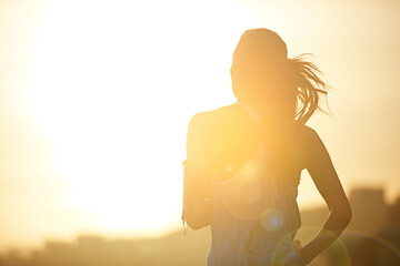 Woman, running and back in sunrise for training by mockup space for silhouette with sky in city....