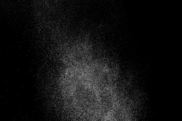 White grunge texture on black backdrop. Abstract splashes of water on dark background. Light clouds overlay texture.	
