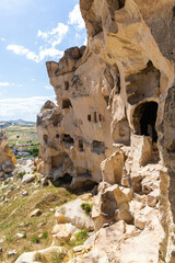 Weathered, multi-chambered cave complex in Cavusin, dramatic natural formations and openings...